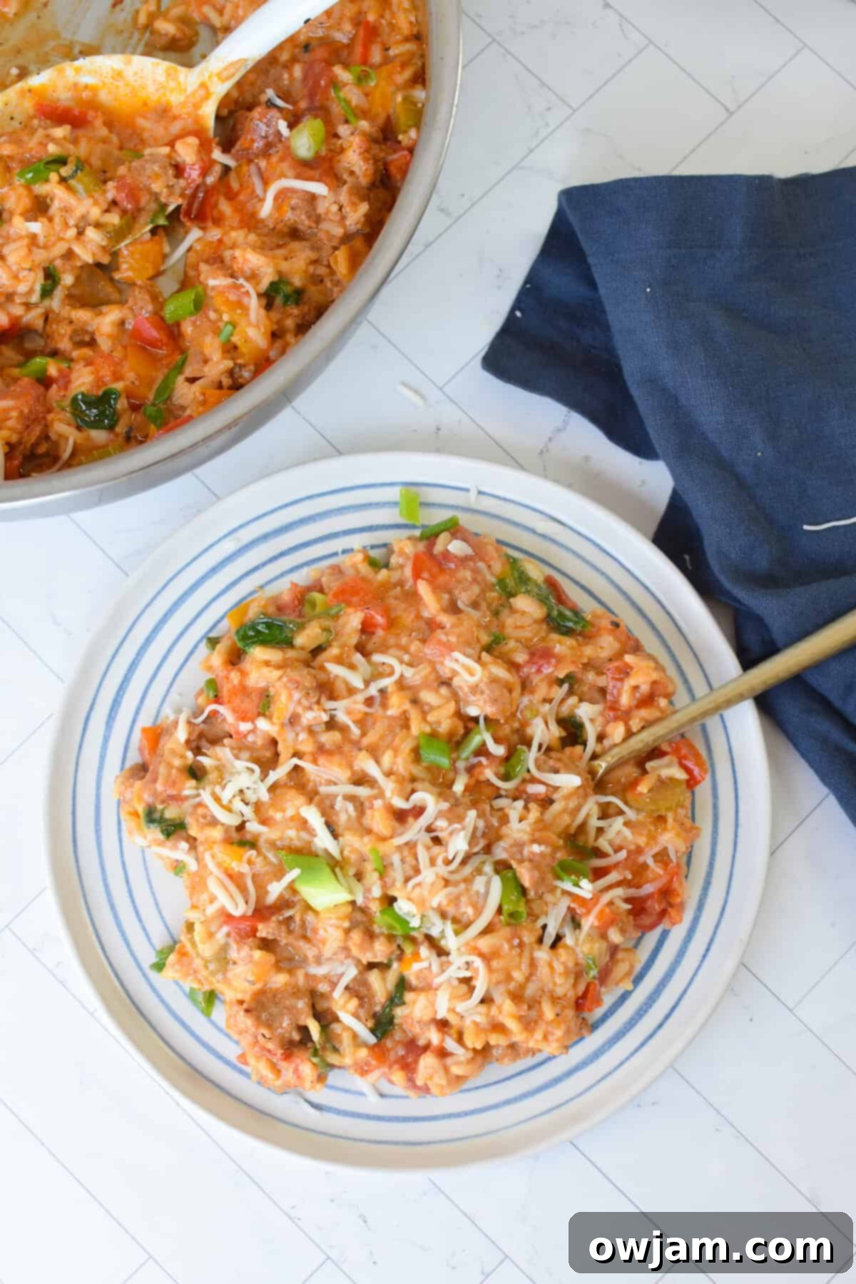 Creamy Cajun Sausage and Rice Skillet 3 A serving of Creamy Cajun Sausage Rice Skillet on a white plate