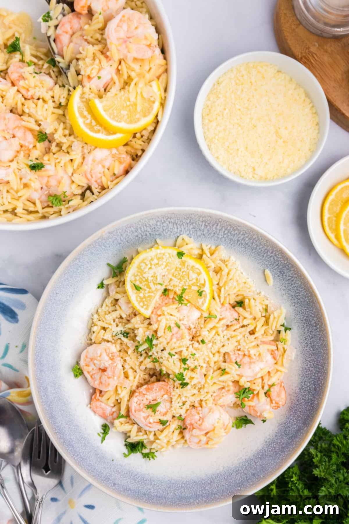 Zesty Lemon Shrimp with Orzo 3 Close-up of Lemon Shrimp and Orzo pasta in a blue bowl, garnished with fresh parsley