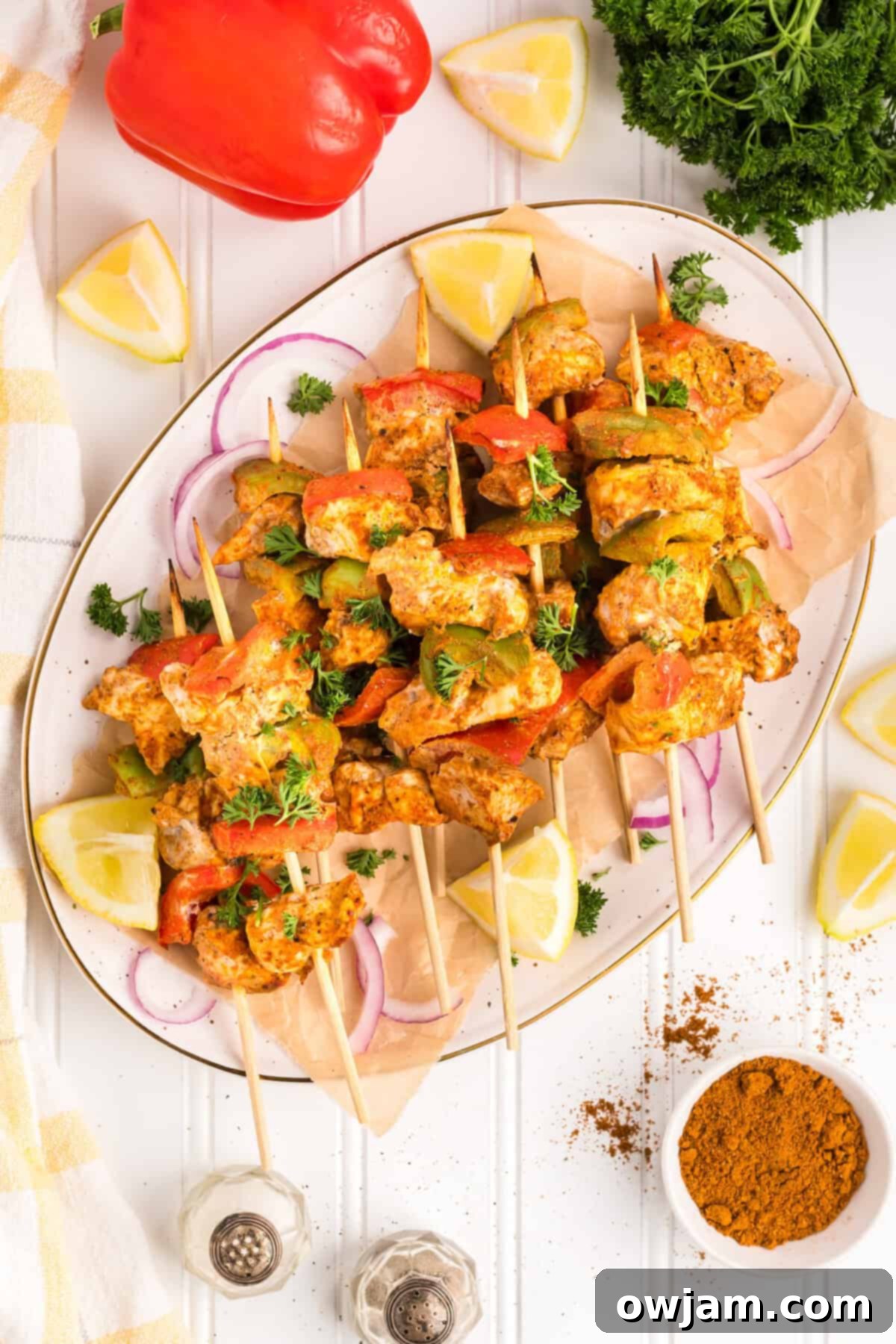 Flavorful Chicken Tikka Skewers 10 Chicken Tikka Kebabs on a white plate