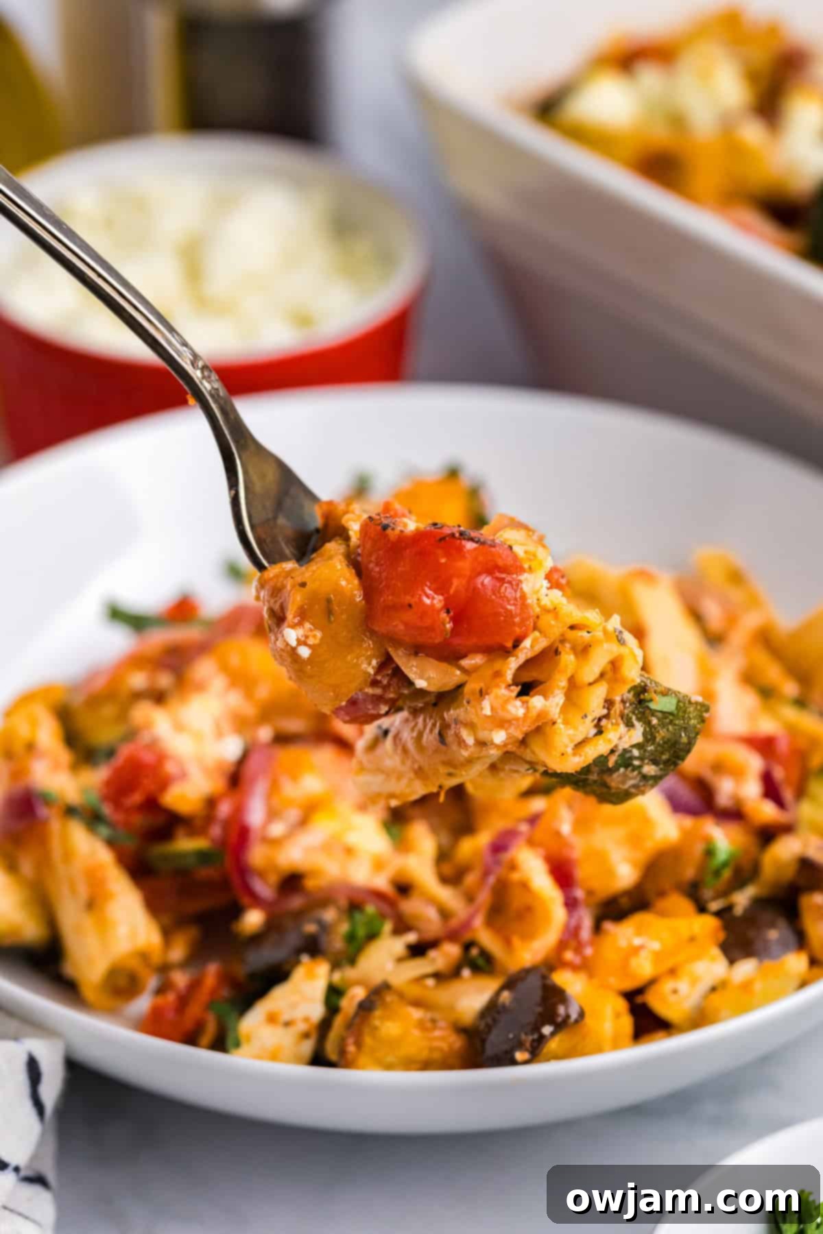 Mediterranean Roasted Vegetable Pasta Bake pasta on a fork
