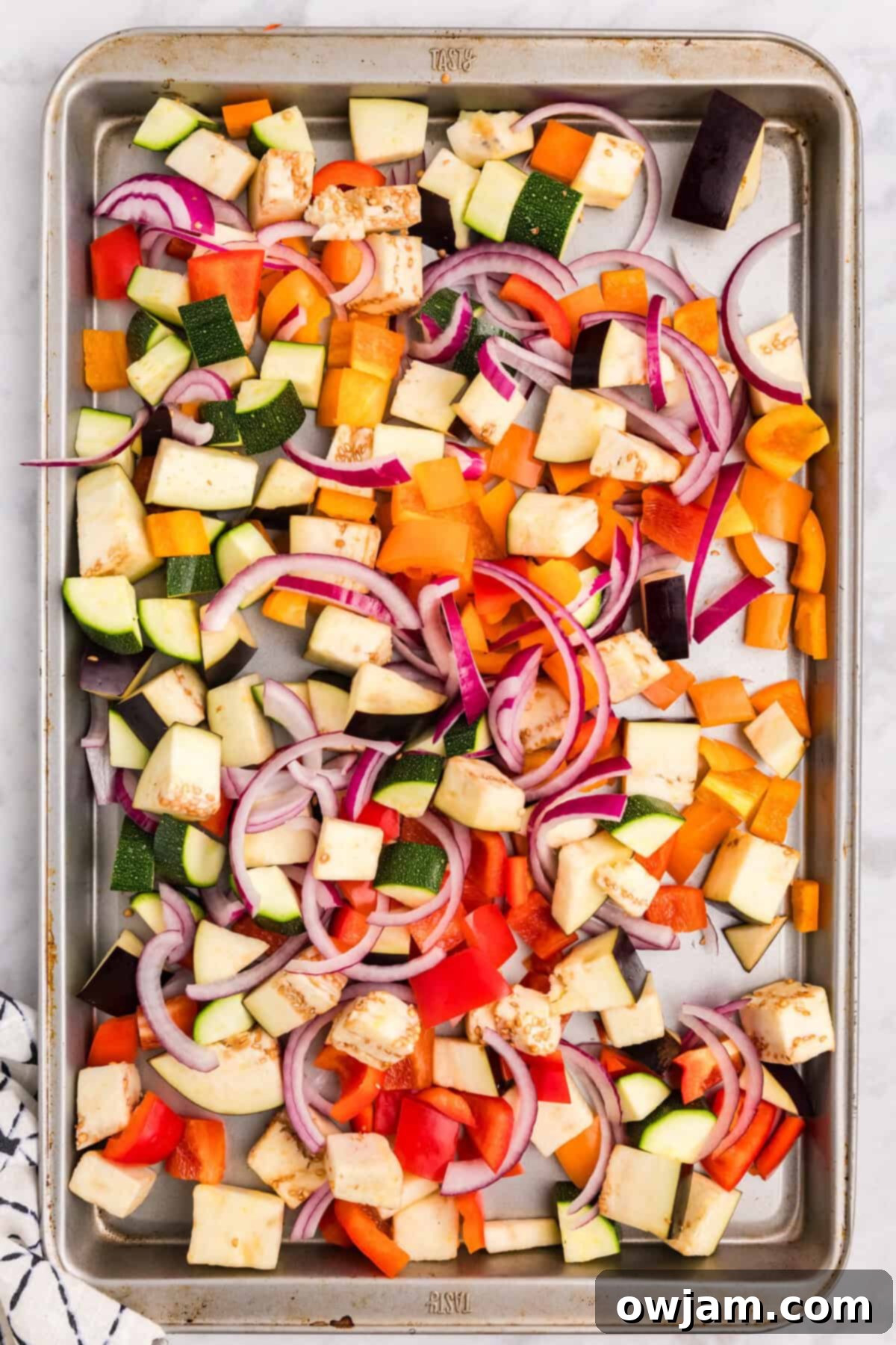 Mediterranean Roasted Vegetable Pasta Bake vegetables on a baking sheet 