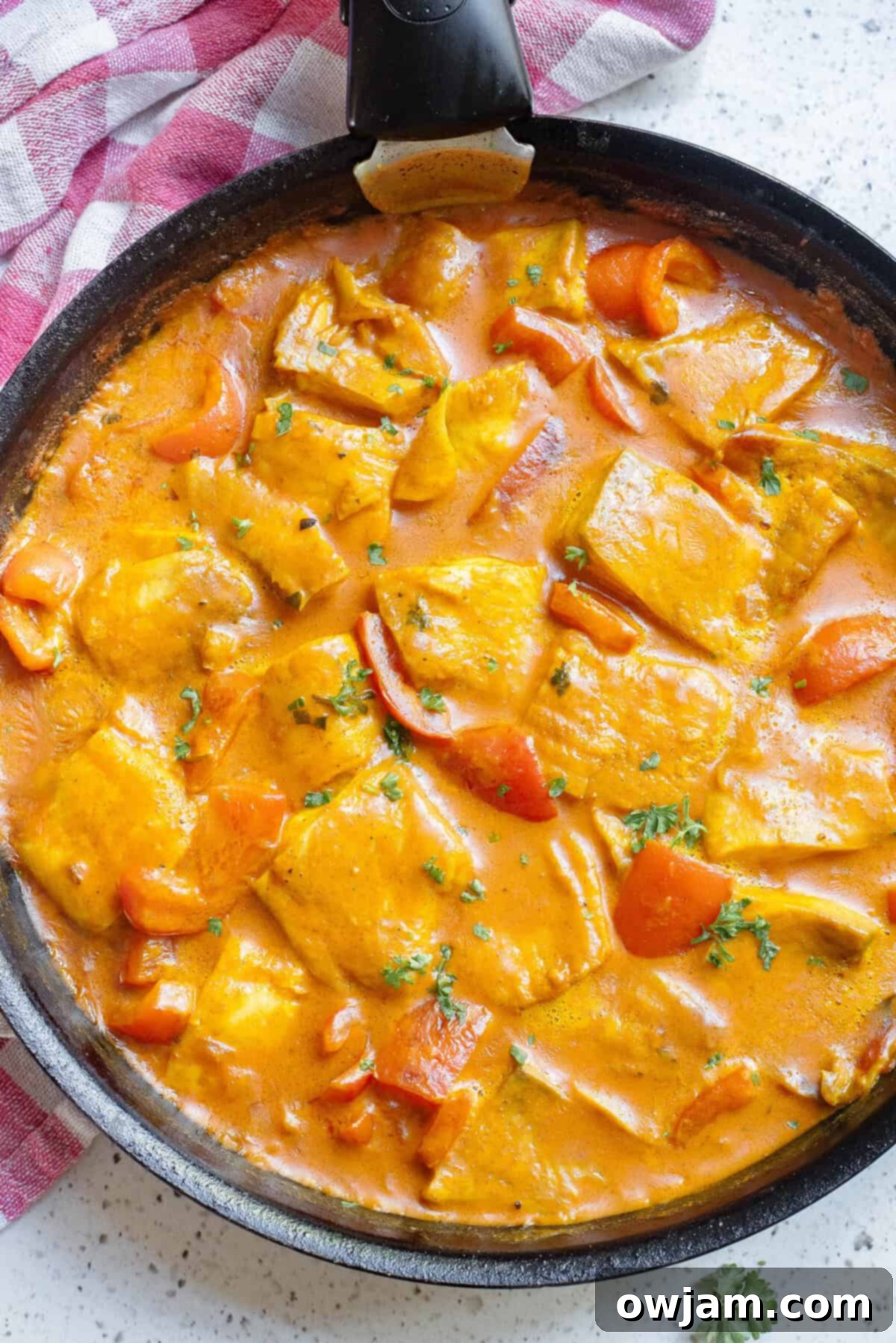 Luscious Coconut Fish Curry 11 A large skillet filled with the finished Coconut Fish Curry, ready to be portioned and served.