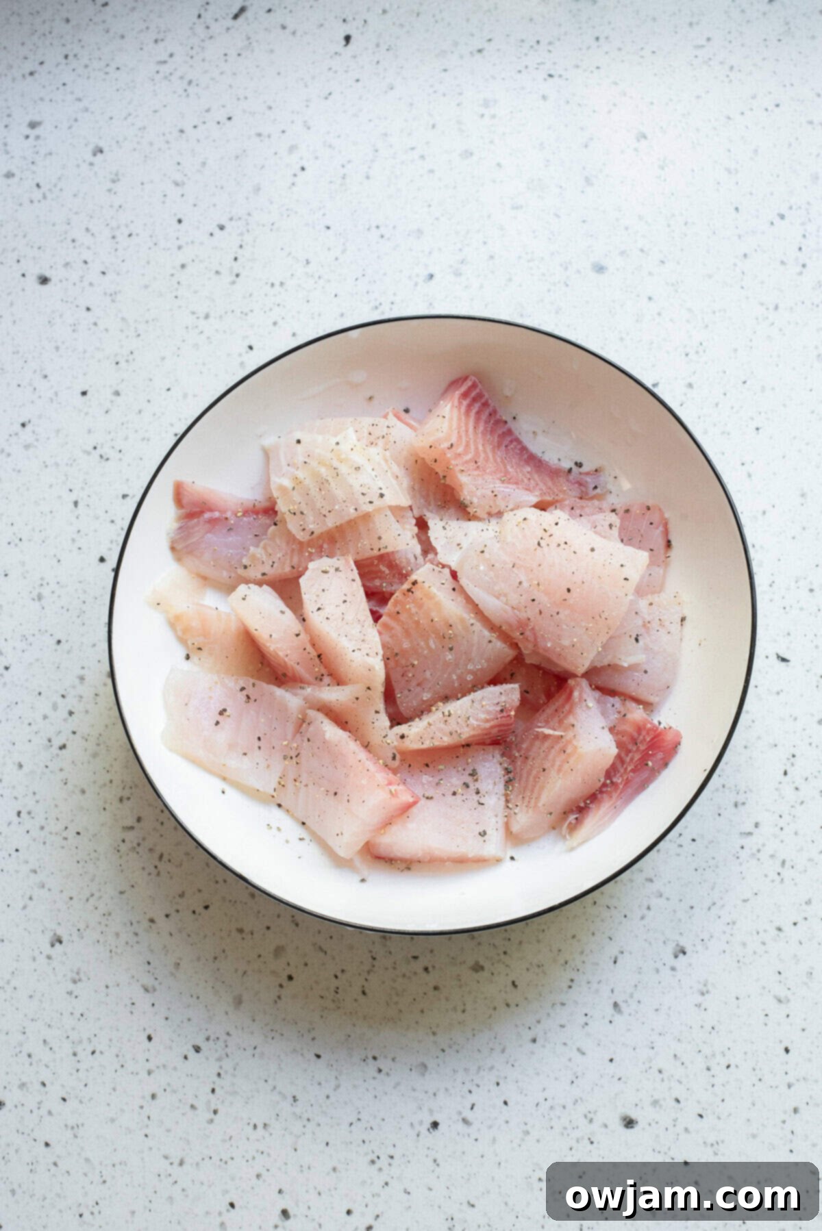 Luscious Coconut Fish Curry 6 Raw white fish fillets cut into chunks, seasoned and ready for the curry.