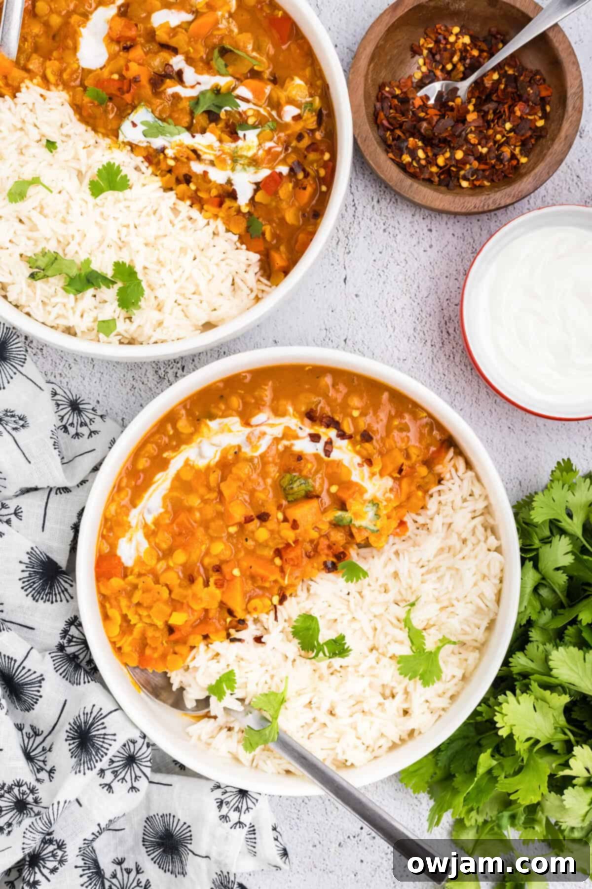 Simple Satisfying Red Lentil Dahl 11 Multiple bowls of Easy Red Lentil Dahl, ready to be served, garnished with cilantro