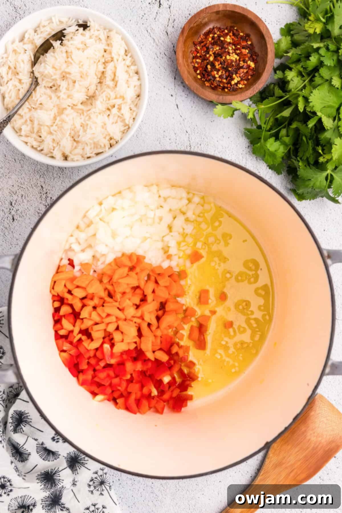 Simple Satisfying Red Lentil Dahl 6 Chopped garlic, onions, red bell pepper, and carrots sautéing in olive oil in a large pot