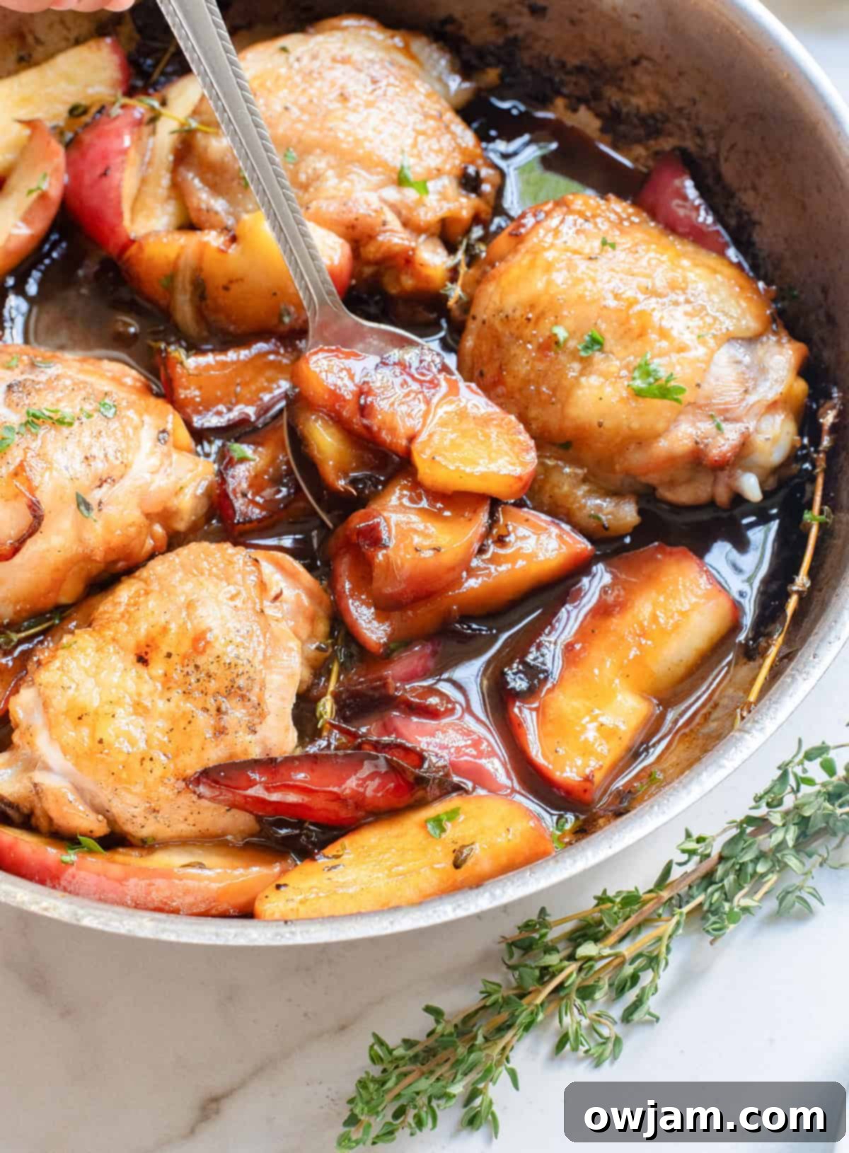 Golden Cider Chicken Skillet 5 Skillet Apple Cider Chicken with a spoon