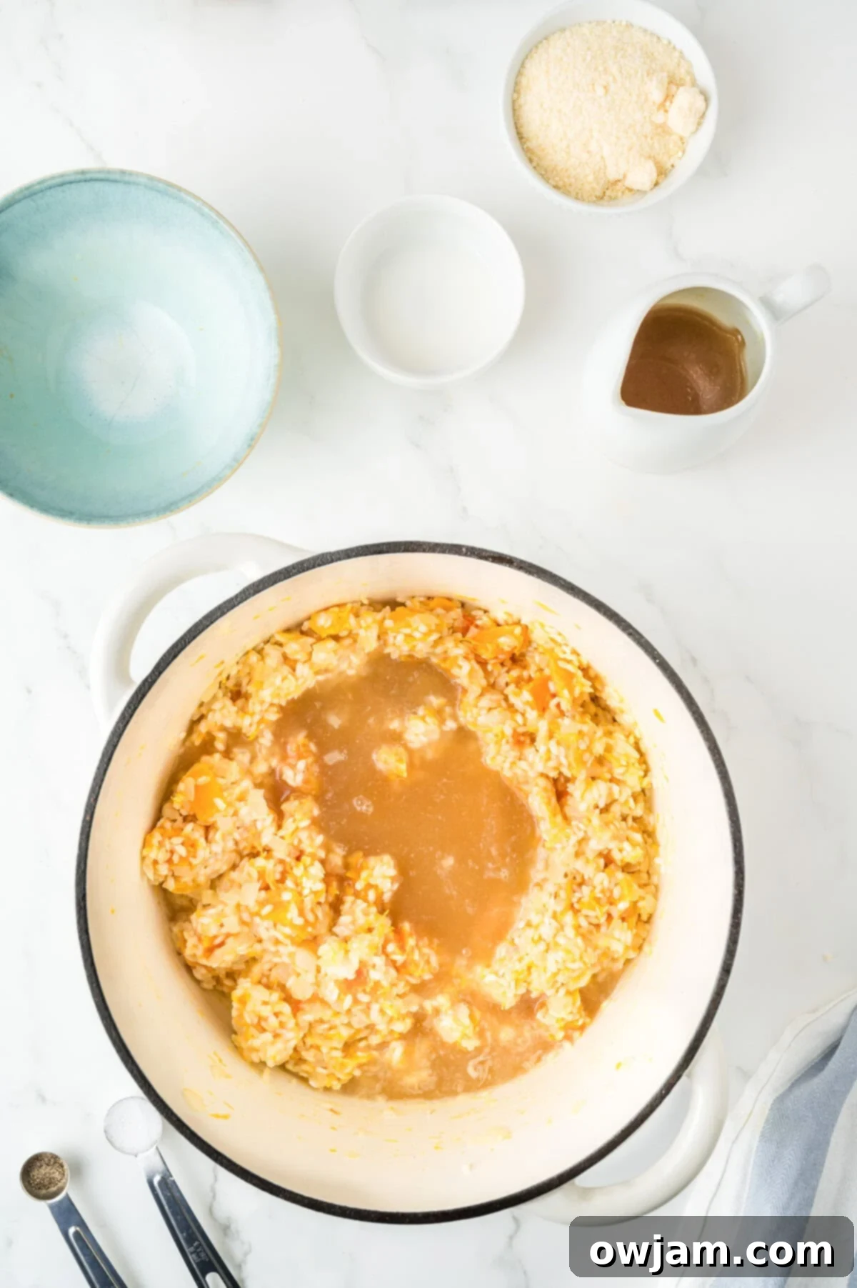 Butternut Squash Sage Risotto broth with rice in a pot