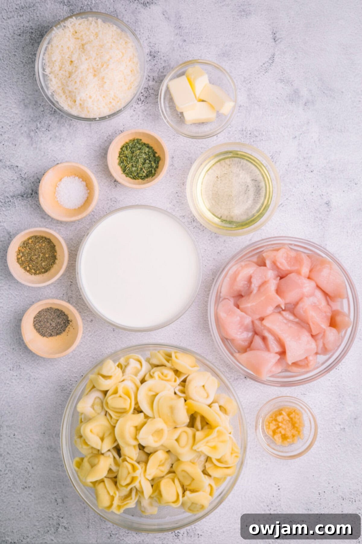 All the fresh ingredients laid out for making Olive Garden Chicken Tortellini Alfredo.