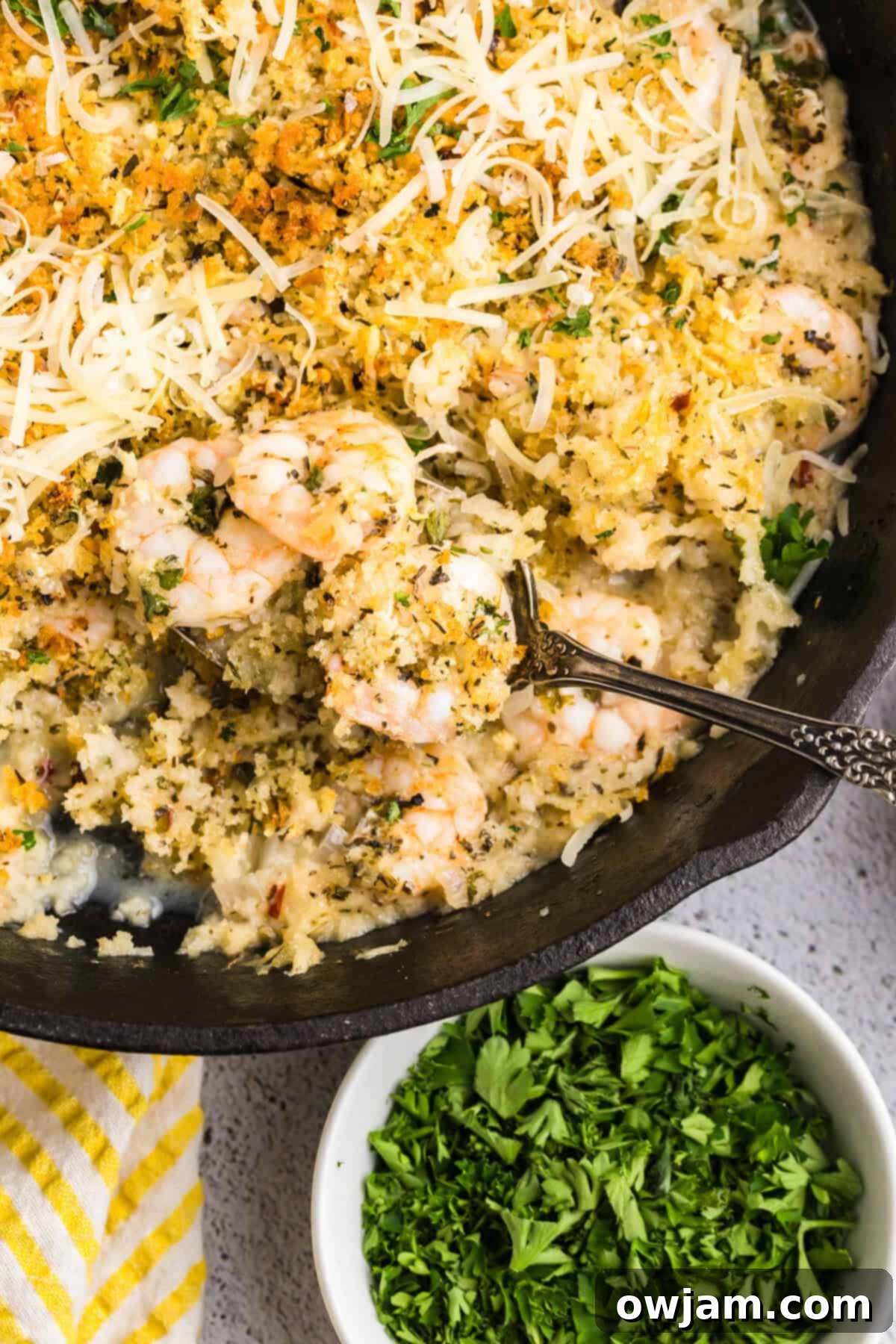 Effortless Crispy Shrimp 11 Easy Breaded Shrimp in a cast iron skillet with a spoon