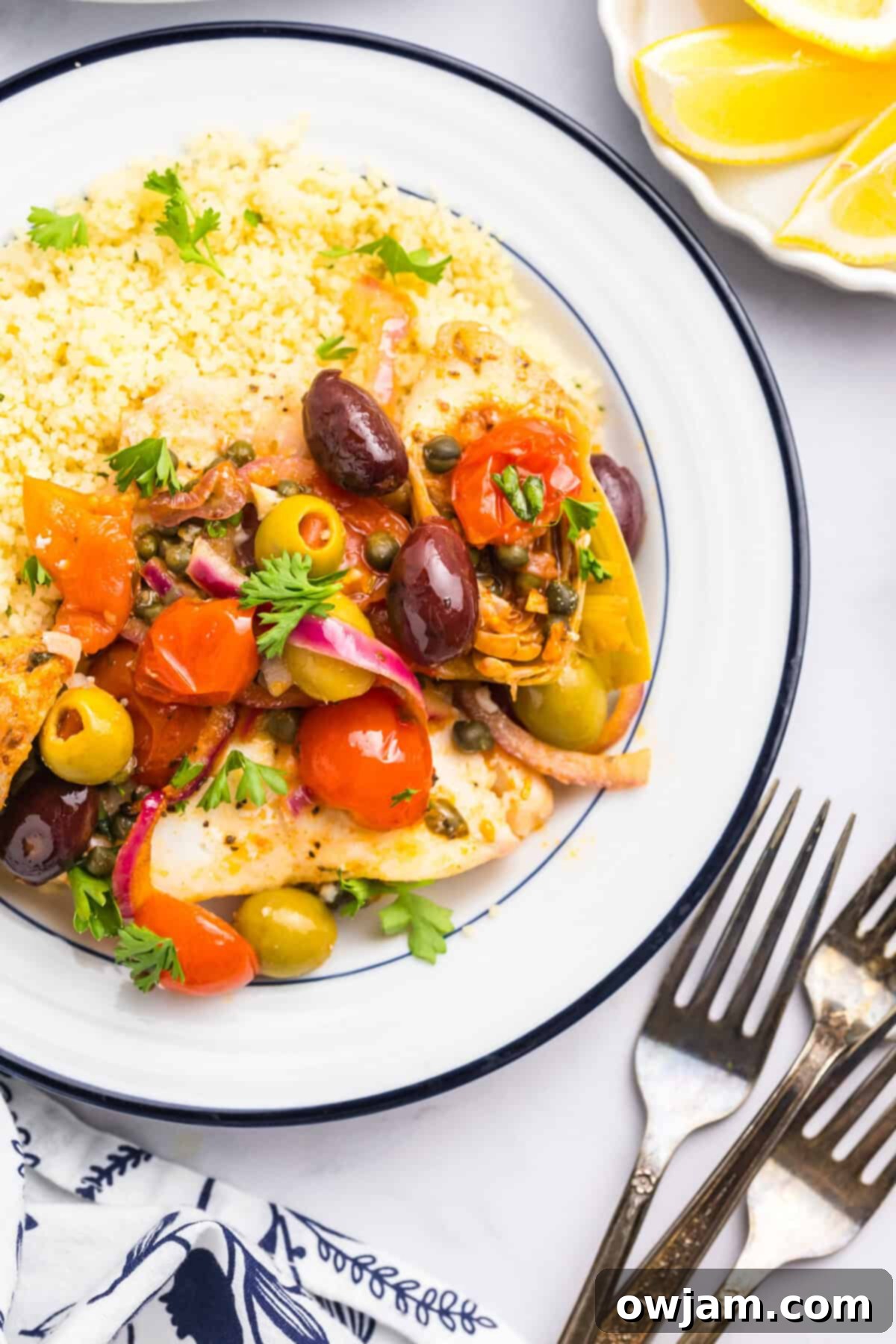 Sun-Kissed Mediterranean Fish Bake 5 Mediterranean Baked Fish on a white plate