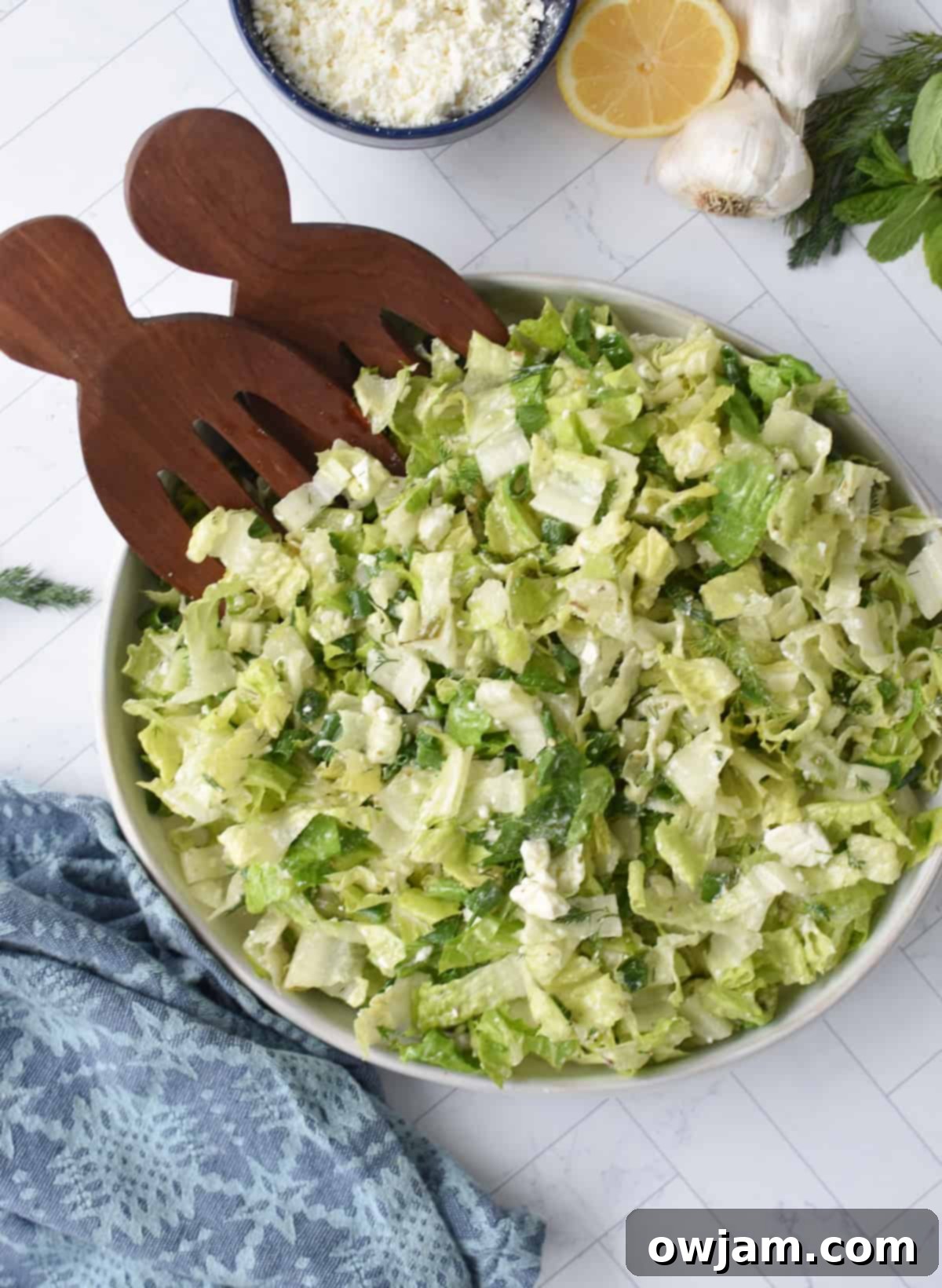 Maroulosalata Crisp Greek Lettuce Salad 5 Maroulosalata with wooden serving utensils