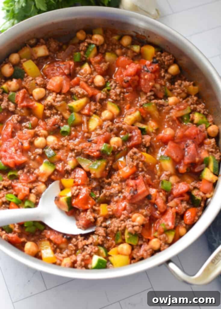 Another view of the Mediterranean Ground Beef Skillet in the pan, showing the rich texture and vibrant ingredients
