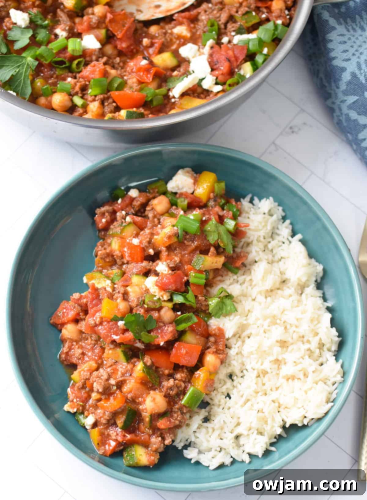 A large bowl of Mediterranean Ground Beef Skillet, perfectly portioned and garnished