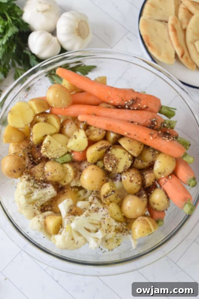 One Pan Zaatar Chicken 11 Sheet Pan Za’atar Chicken potatoes and veggies in bowl