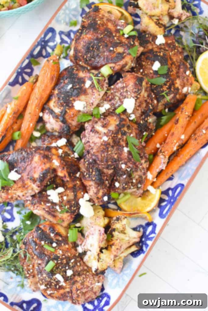 One Pan Zaatar Chicken 7 Sheet Pan Za’atar Chicken on white and blue platter