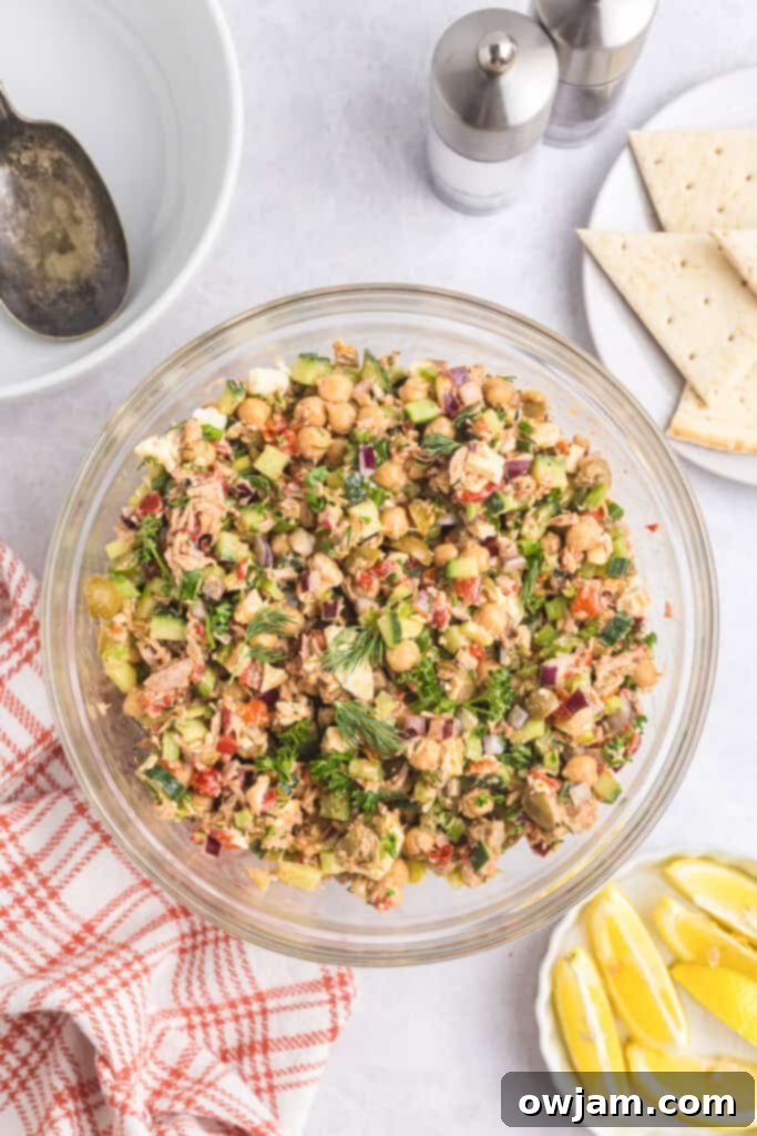 Refreshing Mediterranean Tuna and Chickpea Salad 11 Mediterranean Tuna and Chickpea Salad in a clear bowl, ready to be served
