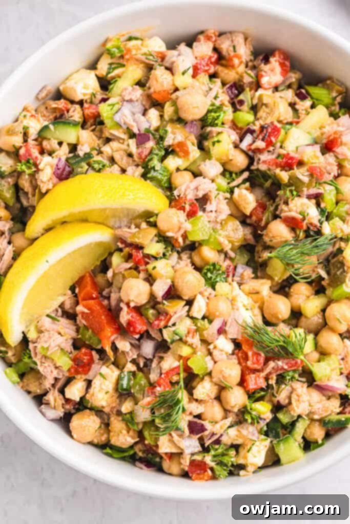 Refreshing Mediterranean Tuna and Chickpea Salad 5 Mediterranean Tuna and Chickpea Salad in a big bowl being mixed