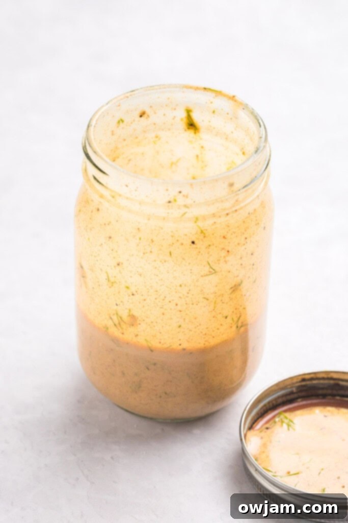 Refreshing Mediterranean Tuna and Chickpea Salad 8 Mediterranean Tuna and Chickpea Salad dressing ingredients in a mason jar