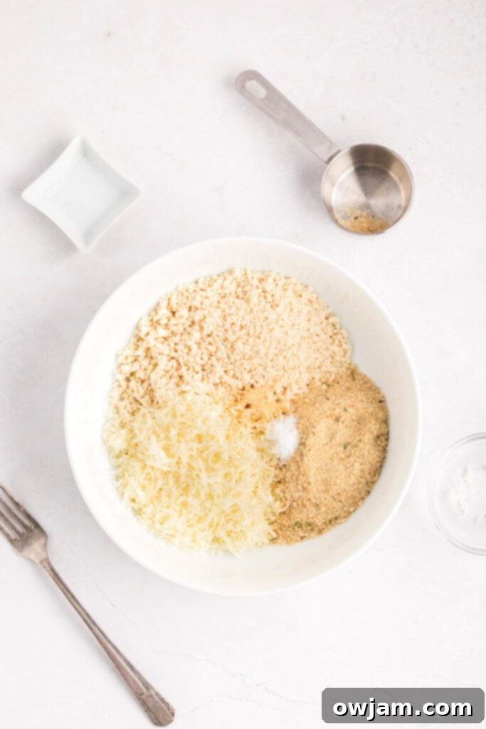 Crispy Air Fryer Zucchini Sticks 12 Bowl with seasoned breadcrumb mixture for coating zucchini fries.
