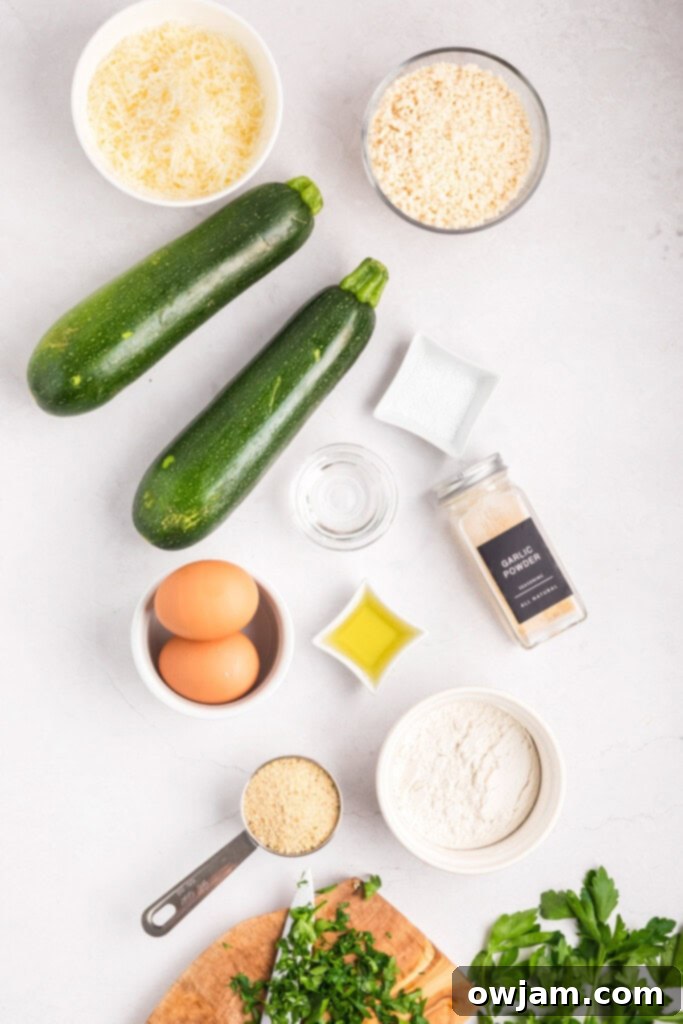 Crispy Air Fryer Zucchini Sticks 4 Ingredients laid out for Air Fryer Zucchini Fries recipe including zucchini, eggs, breadcrumbs, and cheese.