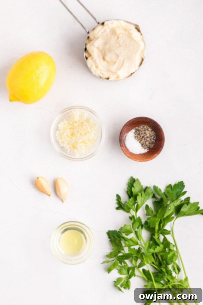 Crispy Air Fryer Zucchini Sticks 5 Ingredients for Garlic Lemon Aioli including mayonnaise, garlic, lemon, and parsley.