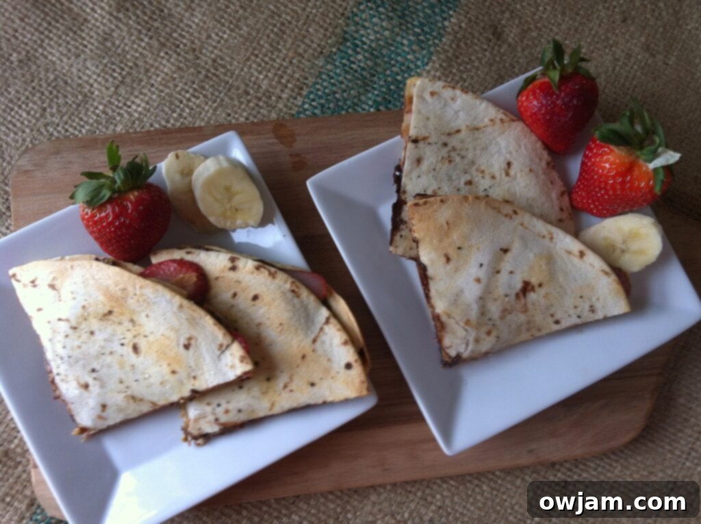 Two halves of a Dessert Quesadilla showing its fruit and chocolate filling.