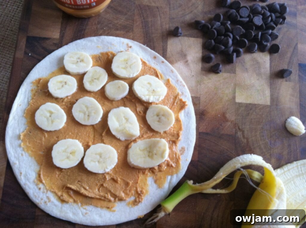 Banana slices arranged on peanut butter for a Dulce Quesadilla.