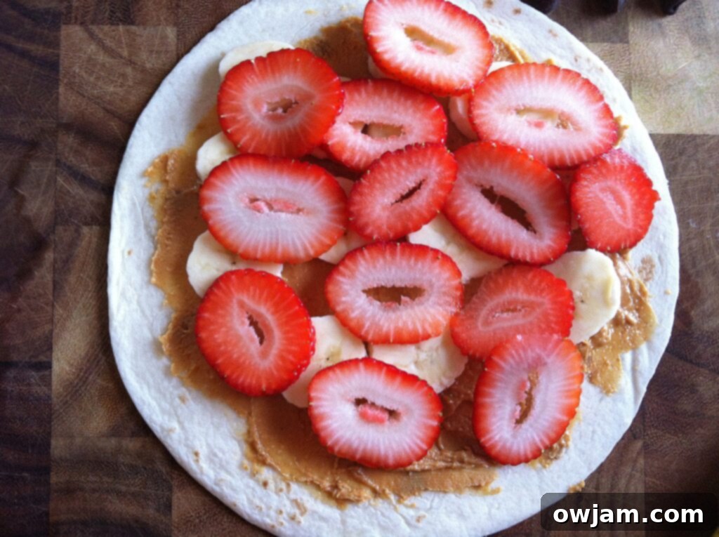 Sliced strawberries layered over bananas on a Dulce Quesadilla.