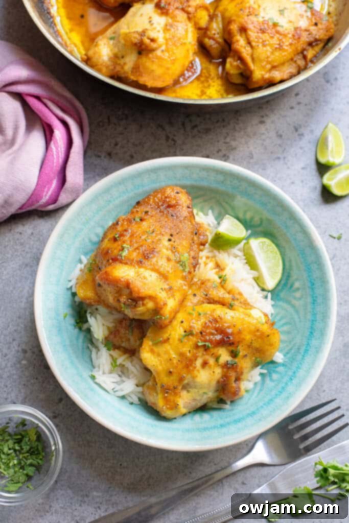 Golden Turmeric Chicken 5 Turmeric Chicken in blue bowl with limes