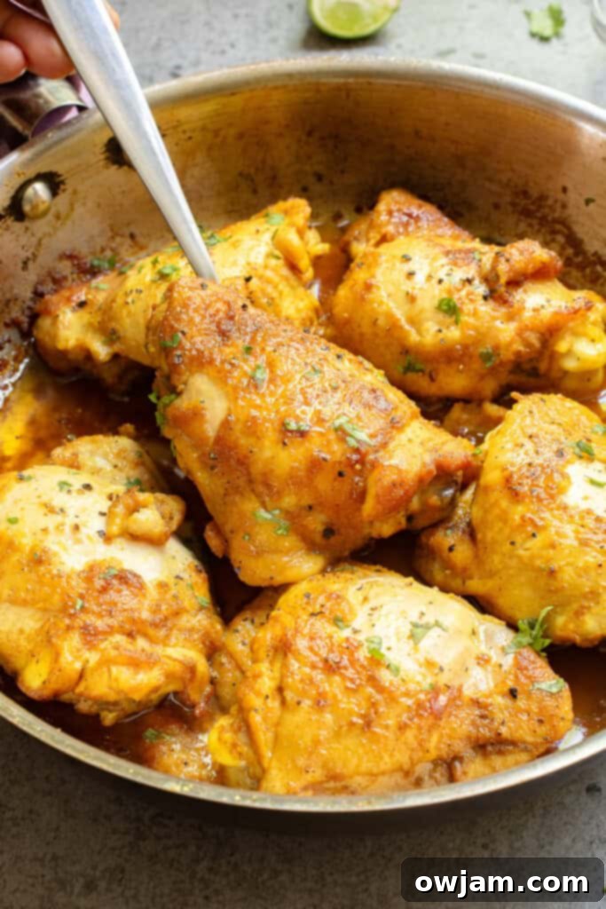 Golden Turmeric Chicken 8 Turmeric Chicken with fork in skillet