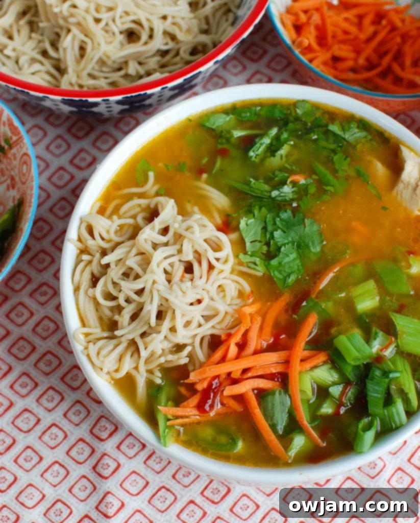 Asian Chicken Noodle Soup in a white bowl