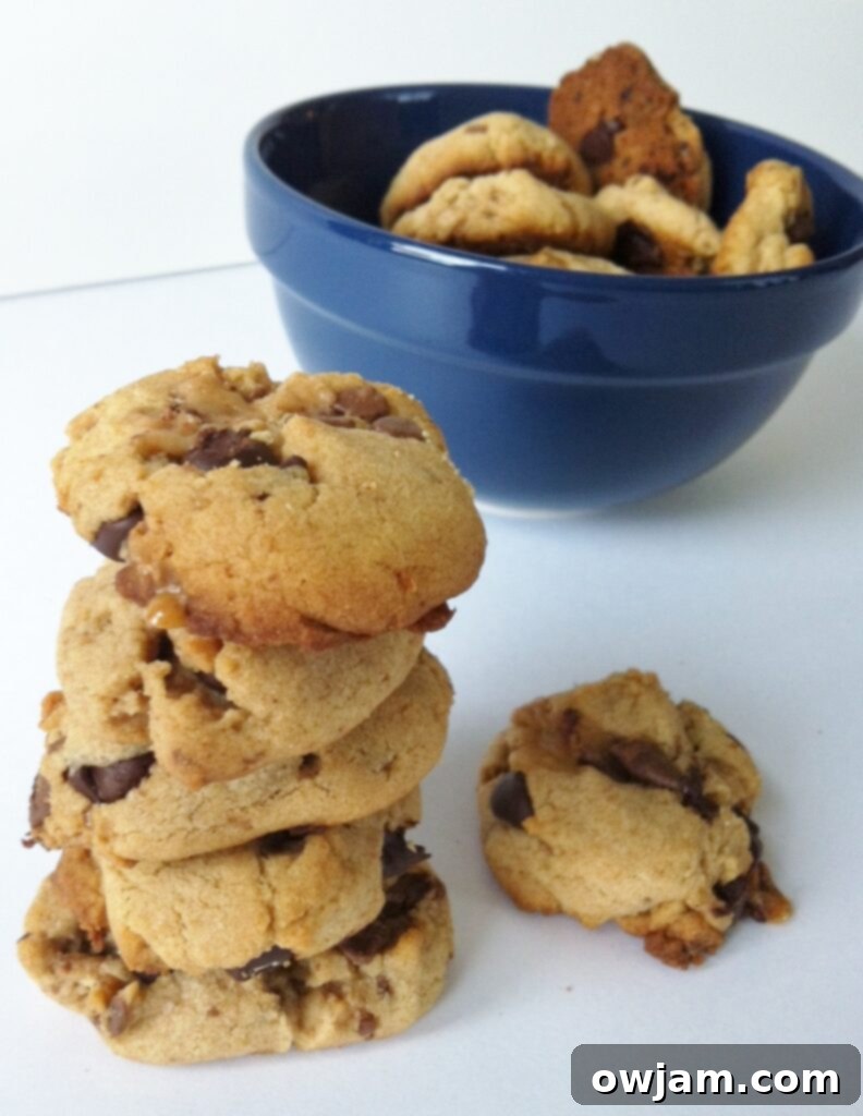 Close-up shot of freshly baked Peanut Butter Toffee Cookies on a cooling rack, showcasing their texture
