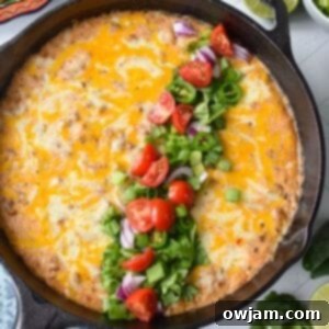 Beefy Cottage Cheese Queso 10 Cottage Cheese Queso in a skillet with garnishes 1200 x 1200