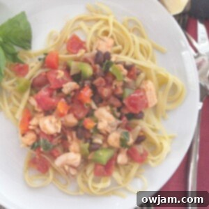 A top-down view of the delicious Salmon Linguine, featuring tender salmon, colorful vegetables, and linguine pasta.