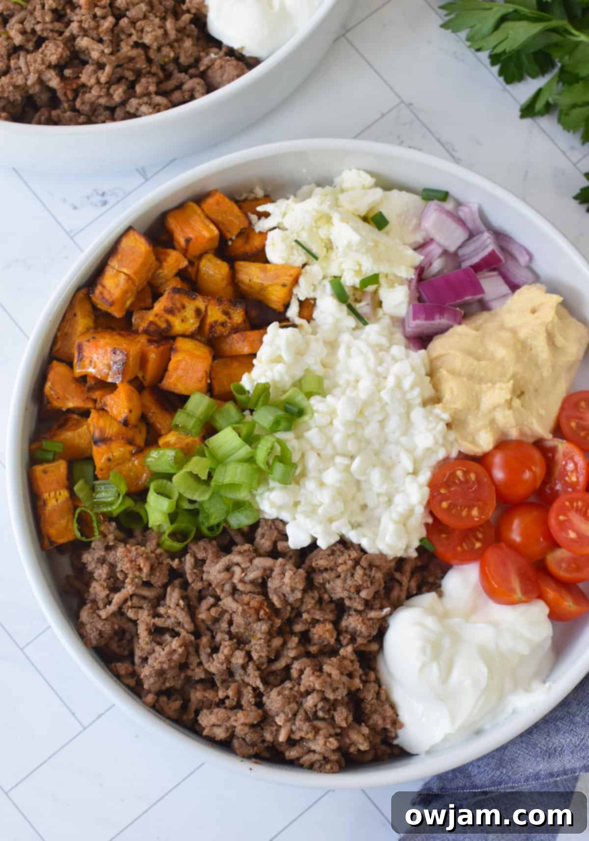 Hearty Sweet Potato Cottage Cheese Ground Beef Bowls 5 Sweet Potato Cottage Cheese Bowls in white bowl with garnishes