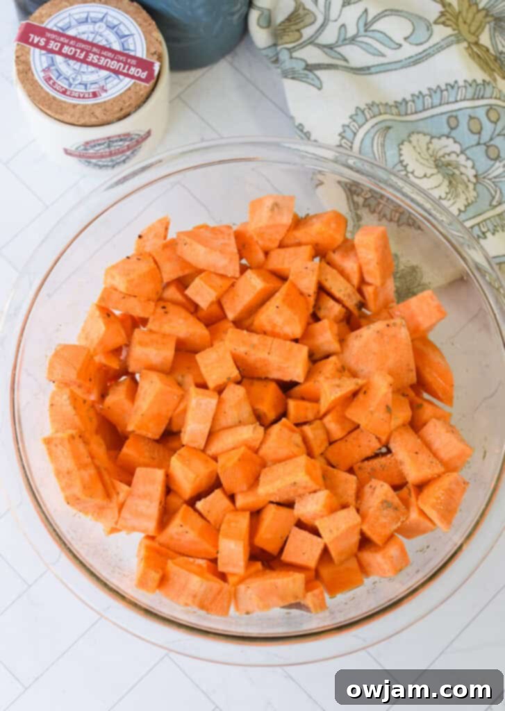 Hearty Sweet Potato Cottage Cheese Ground Beef Bowls 8 Sweet Potato Cottage Cheese Bowls sweet potatoes with olive oil and spices in a glass bowl
