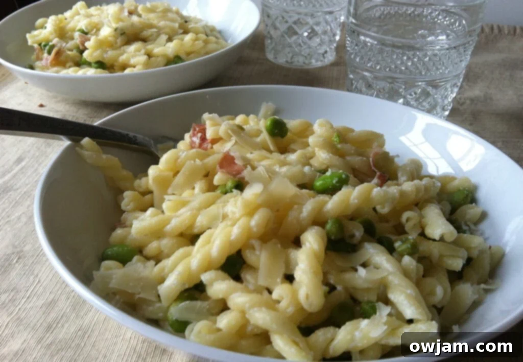 Spring Pasta with Peas Favas and Prosciutto 5 A large serving of spring pasta, ready to be enjoyed