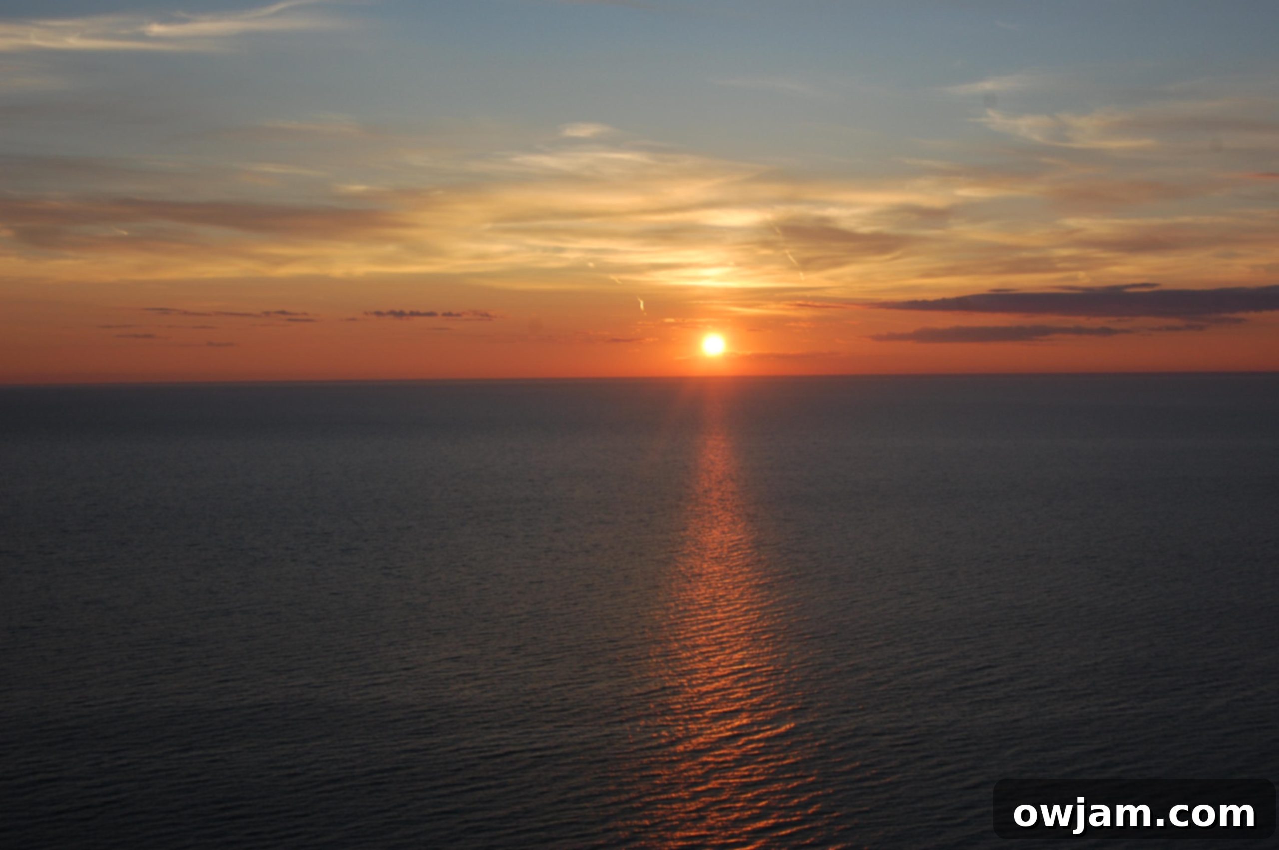 Dramatic colors of a sunset over the dunes.