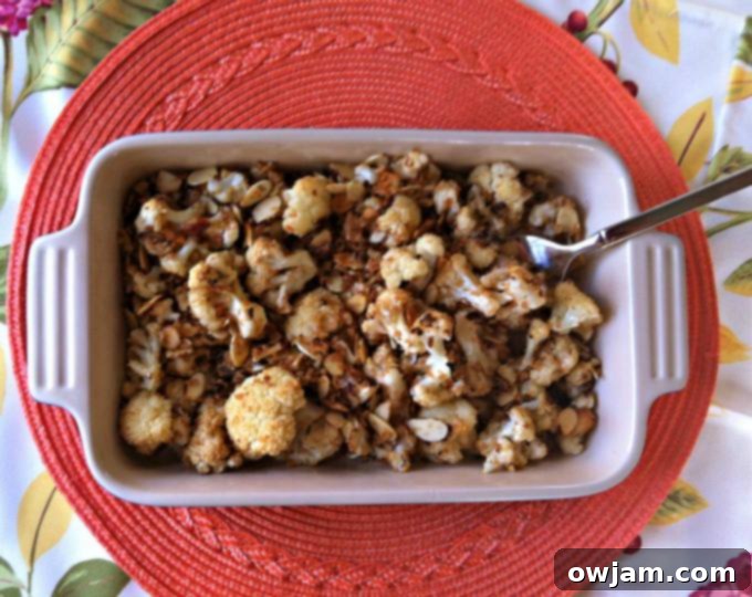 Generous serving of delicious Roasted Cauliflower with Almond Panko Topping in a bowl.