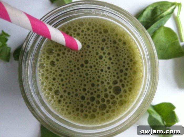 Close-up of Green Smoothie with bubbles, showing freshness