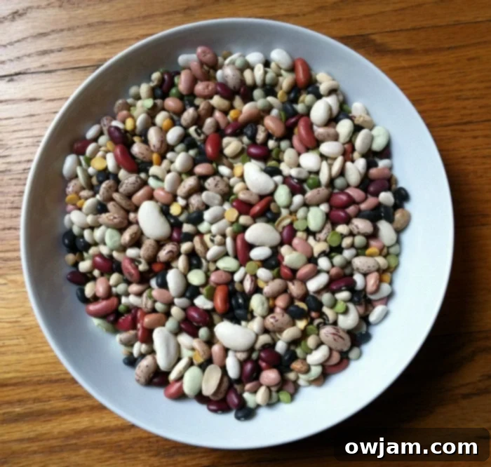 A close-up of a bag of dried 15 bean soup mix, showing the variety of legumes before cooking.