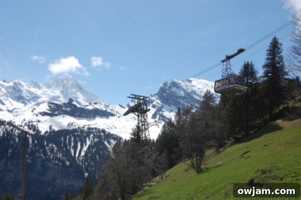 Another view of a cable car traversing the breathtaking mountainous terrain of Interlaken, Switzerland.