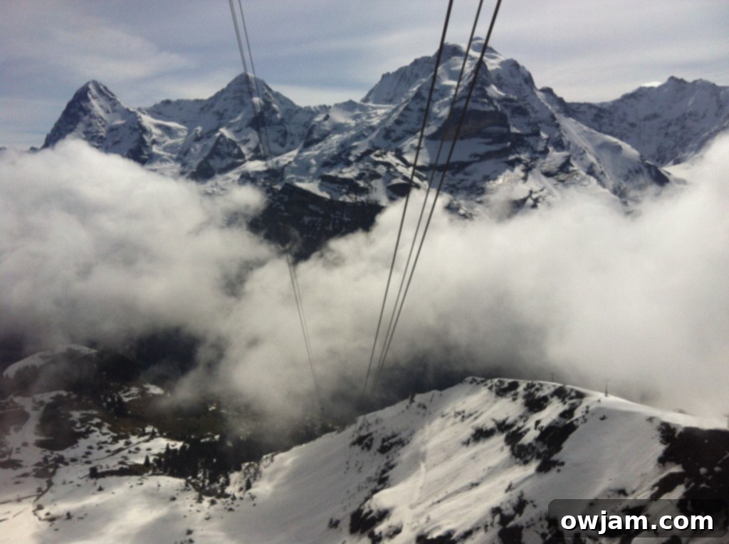 The impressive Schilthorn summit building, Piz Gloria, with stunning alpine scenery surrounding it.