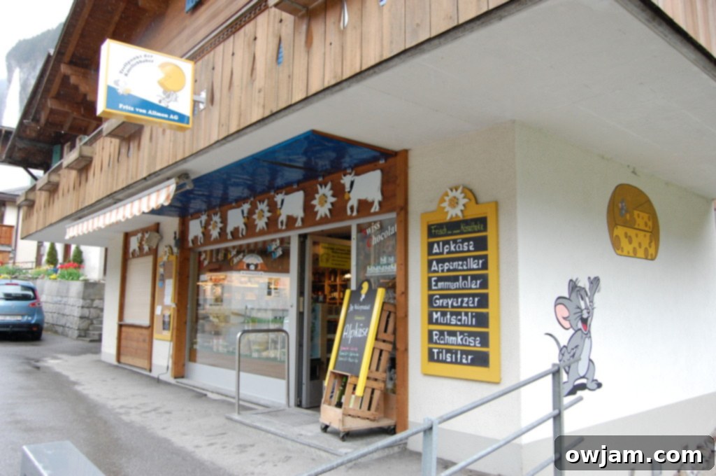 A traditional cheese shop in Lauterbrunnen, Switzerland, displaying various types of local cheeses.