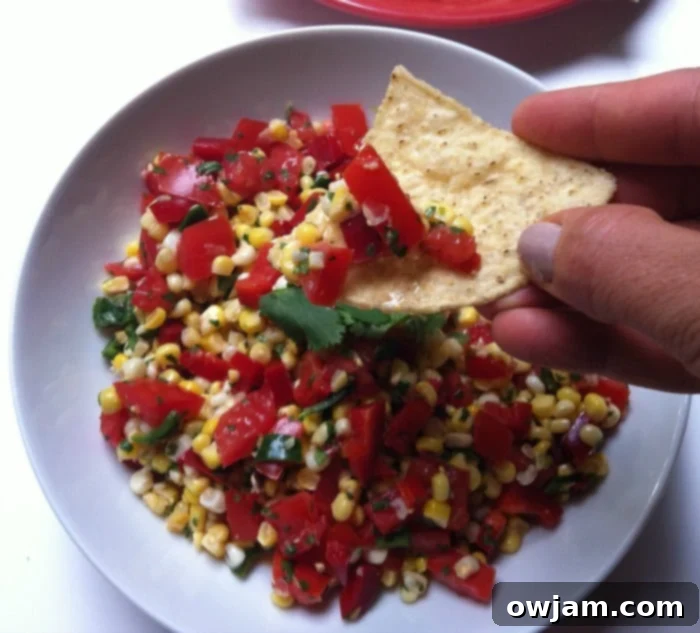 Tortilla chip full of delicious Grilled Corn Salsa