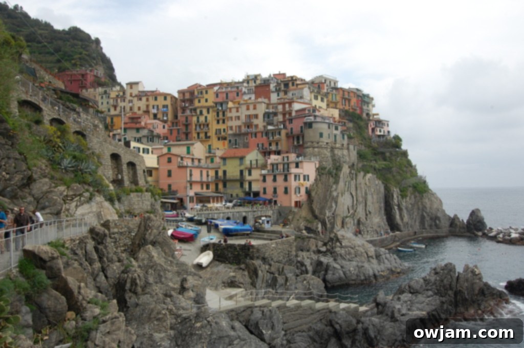 Stunning coastal view of a Cinque Terre village from a hiking trail
