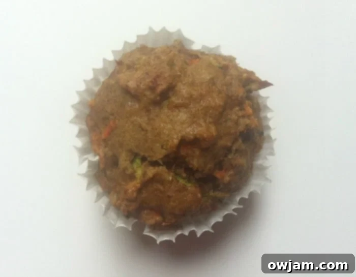 A plate of golden-brown carrot and zucchini muffins, ready to be enjoyed as a wholesome snack or breakfast.