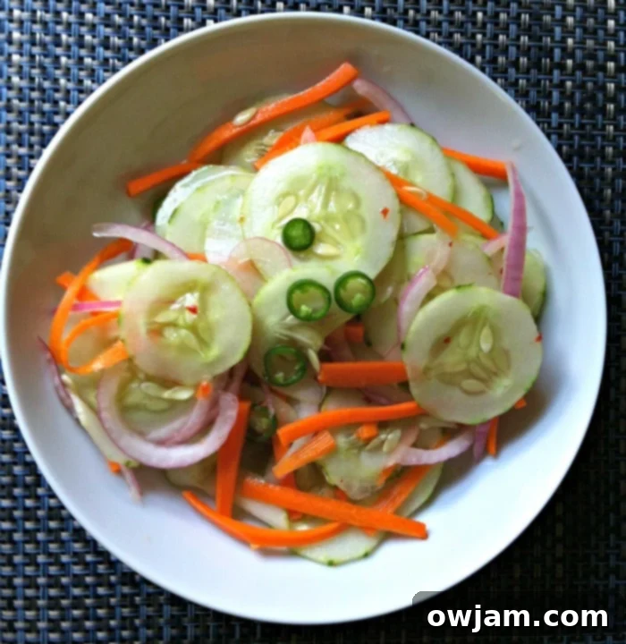 Asian Cucumber Salad bowl with chopsticks