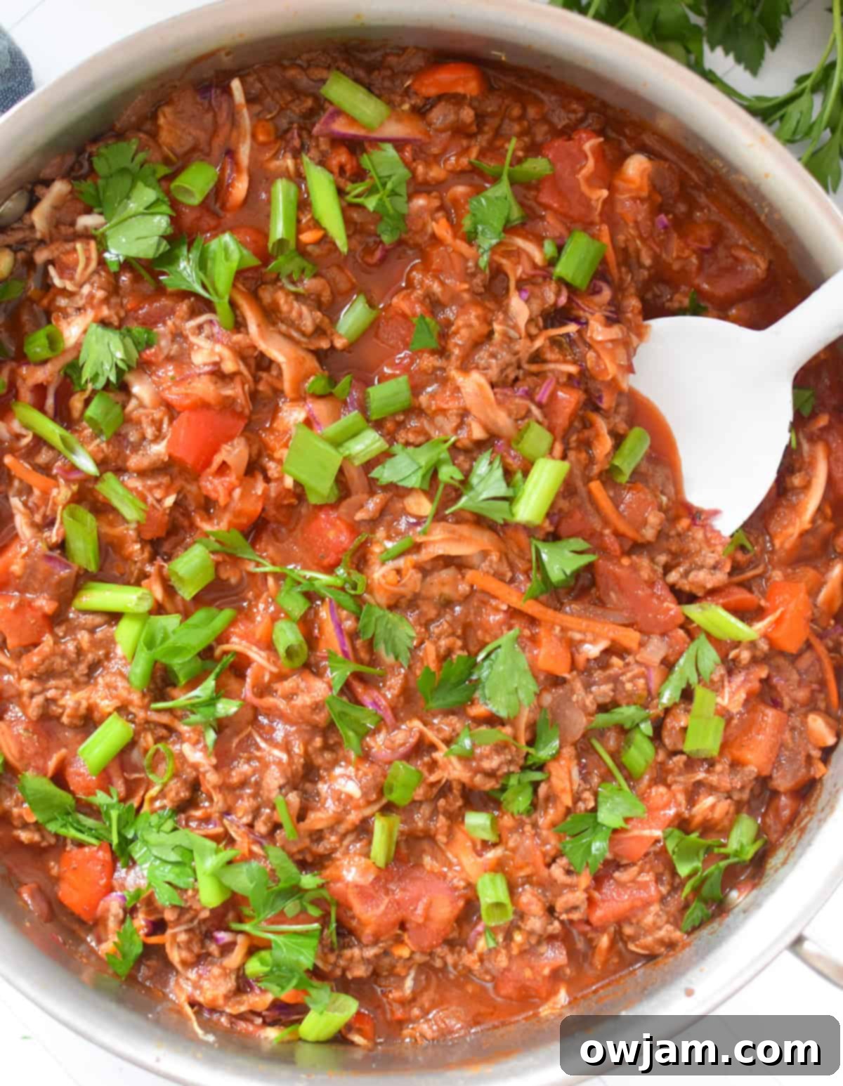 Mediterranean Beef Cabbage Skillet 11 Mediterranean Beef and Cabbage Stir-fry with white spoon