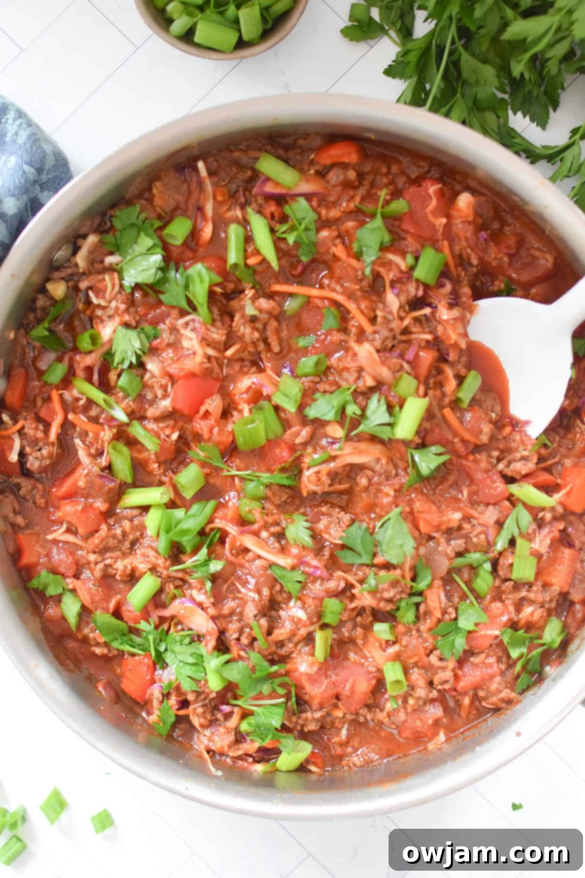 Mediterranean Beef Cabbage Skillet 7 Mediterranean Beef and Cabbage Stir-fry with a white spoon